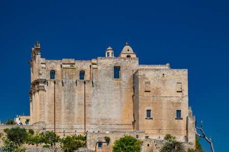Matera, Basilicata, Italy - Panoramic view through a small slit, window, of the Sassi of Matera, Barisano and Caveoso. The ancient houses of stone and brick, carved into the rock. The ravine below.のeditorial素材