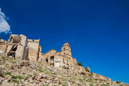Craco, Matera, Basilicata, Italy. The ghost town destroyed and abandoned following a landslide. The ancient church of the city, with its bell tower, almost completely destroyed.のeditorial素材