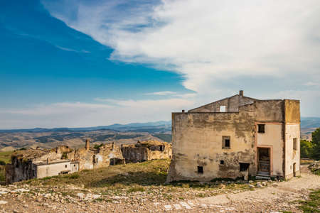 Craco, Matera, Basilicata, Italy. The ghost town destroyed and abandoned following a landslide. The ancient church of the city, with its bell tower, almost completely destroyed.のeditorial素材