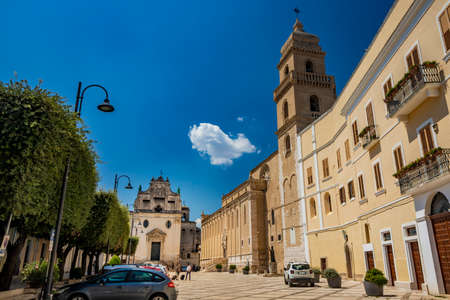 August 12, 2020 - Gravina in Puglia, Italy - The main square of the ancient city, overlooked by a church and the cathedral with the bell tower.のeditorial素材