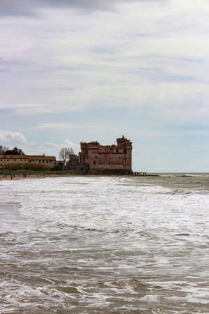 the castle of Santa Severa on a cold winter day. The cloudy white sky. In Lazio, Italy, Romeのeditorial素材