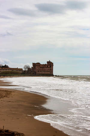 the castle of Santa Severa on a cold winter day. The cloudy white sky. In Lazio, Italy, Romeのeditorial素材
