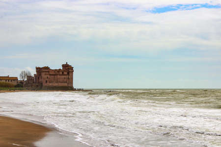 the castle of Santa Severa on a cold winter day. The cloudy white sky. In Lazio, Italy, Romeのeditorial素材