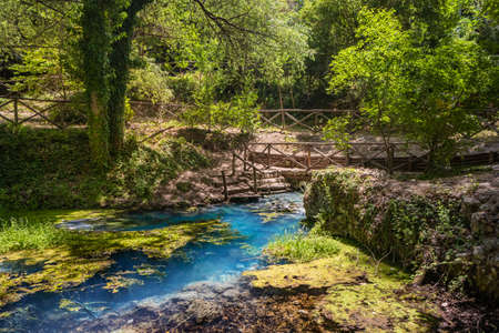 The sulfur springs of Raiano, immersed in a forest and uncontaminated nature, in Abruzzo, Italy. Peace, relaxation, silence, health and well-being. Remains of ancient walls covered with vegetation.の写真素材