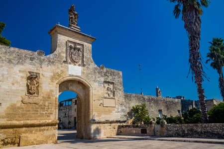 The small fortified village of Acaya, Lecce, Salento, Puglia, Italy. The large stone-paved square. The ancient medieval castle with towers and moat.のeditorial素材
