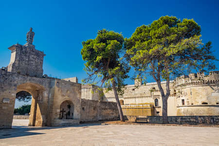 The small village of Acaya, Lecce, Salento, Puglia, Italy. The tower with the clock and the mullioned window. The small square paved in flat stone.のeditorial素材