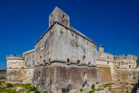 The small village of Acaya, Lecce, Salento, Puglia, Italy. The tower with the clock and the mullioned window. The small square paved in flat stone.のeditorial素材