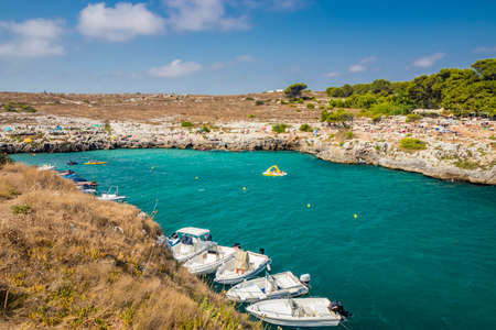 Aug 17, 2021 - Otranto, Puglia, Italy - The small beach of Porto Badisco, famous seaside resort of Salento. Tourists spend their summer holidays. People have fun and swim in the sea.のeditorial素材