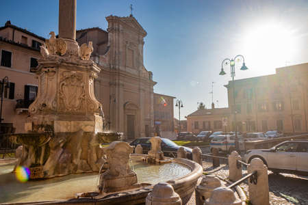 Feb. 6, 2022 - Tarquinia, Viterbo, Lazio, Italy - A glimpse of the main square of the village, seen through a narrow cobbled alley. A street lamp in the blue sky. The municipal theater.のeditorial素材