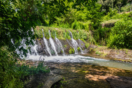 The small medieval village of Corchiano, Viterbo, Lazio. The natural park in the gorge of the Rio Fratta river, rich in vegetation, caves, creeks, small waterfalls, history and archaeological finds.の写真素材