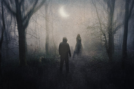 A hooded figure on a woodland path. Looking at a silhouette of a ghostly woman. On a foggy, spooky,...