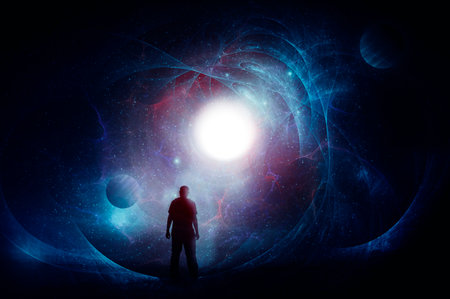 A science fiction concept of a man, back to camera, looking at a bright sun set against a  universe of stars and planets.の写真素材