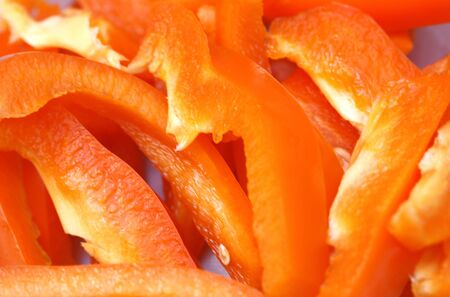 Fresh natural red peper slice to background