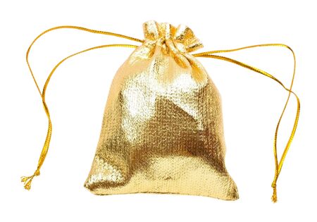 Close-up of a gold gift bag isolated on white backgrounの写真素材