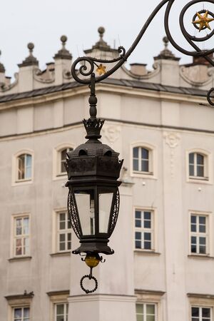 Old lamp on the wall in Krakow (Poland)の写真素材