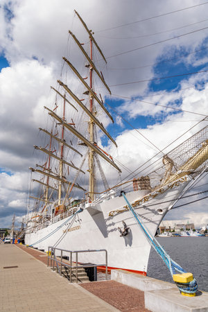 Tourists walk around the marina near sailing ship "Dar Mlodziezy" (Gdynia, Polan ...のeditorial素材