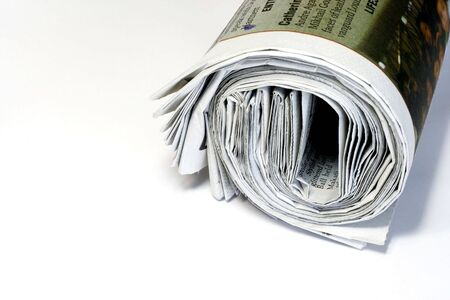 rolled up morning  newspaper with copy spaceの写真素材