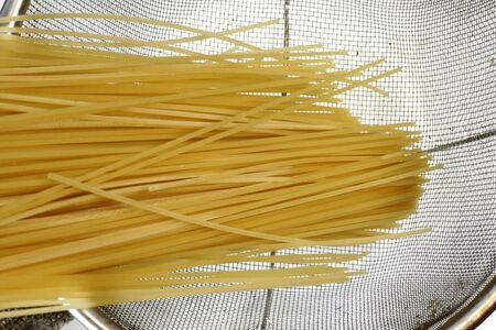 spaghetti in a strainerの写真素材