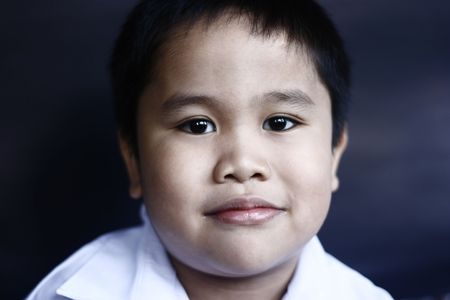 Boy get ready for first day of school in uniformの写真素材