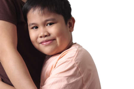Boy embracing his mother isolated in white backgroundの写真素材