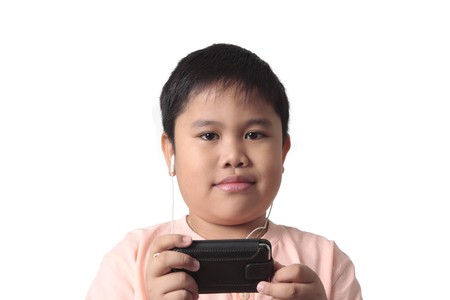 smiling boy with headphones isolated in white background