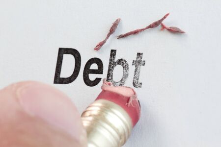 eraser and word debt, concept of Reduce Debt 