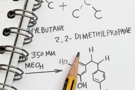 Chemical formula of hydrocarbon with spiral notebook and pencil.の写真素材