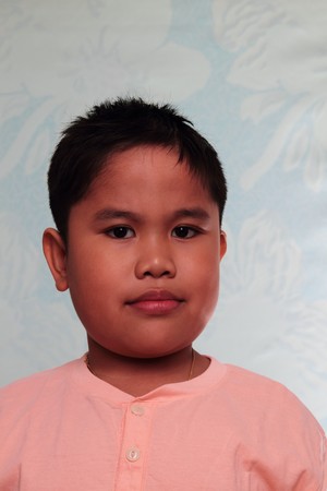 portrait of asian boy in a light color backgroundの写真素材