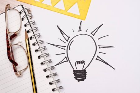 Concept and Ideas represented by sketch of a bulbの写真素材