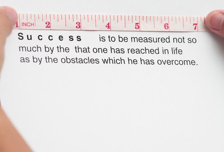 Measuring success concept with tape measure and success wordings.の写真素材