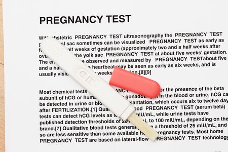 Pregnancy test device over a pregnancy test instruction - many uses in the medical industryの写真素材