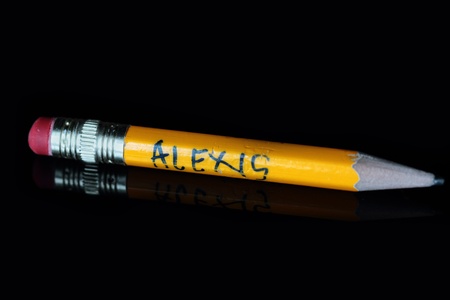 old yellow pencils  isolated on black with reflection 