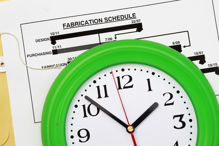 Fabrication schedule with clock - abstract for time frame of projectの写真素材