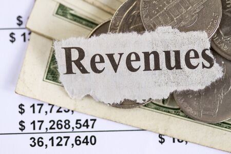 Revenue abstract - cut out in a spreadsheet backgroundの写真素材