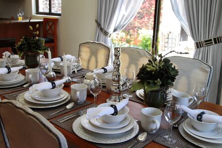 formal dining table set with china, crystal, and silver