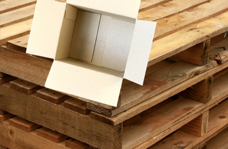 Open Carboard Box - concept for gifts and other ideas with wood crate in tje background の写真素材