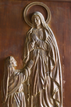 holy mary wood carving  in old christian church in Manila の写真素材
