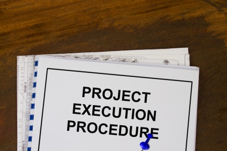 project execution procedure abstract with plans and wood background の写真素材