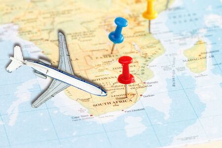 Travel to South Africa with marking push pin and toy airplane  concept .の写真素材