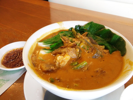 Kare kare, filipino oxtail stew, philippine cuisine in a restaurant settingの写真素材