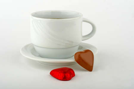 white cup, green tea and chocolate improves mood.の写真素材