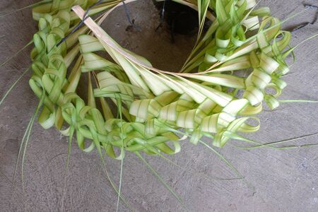 process of creating layur or penjor made from coconut leavesの写真素材