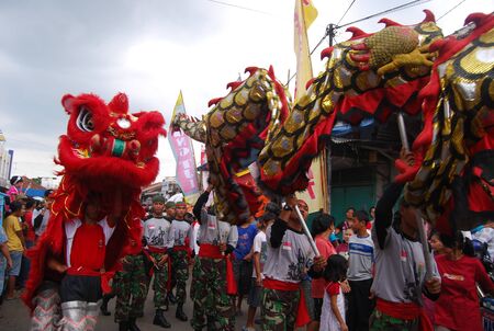 BANYUMAS, INDONESIA - February 8, 2009: People from many culture, age and sex celebrating Imlek or Chinese New Year on the street by paradeのeditorial素材
