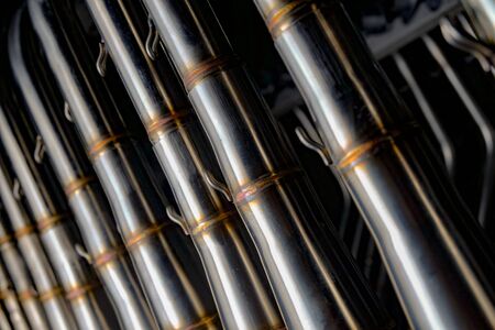 hanged muffler exhaust pipes take with one light techniqueの写真素材