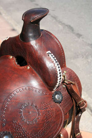 The saddle horn of a handmade embossed leather saddle at a saddle makers shop in Cotacachi, Ecuadorの写真素材