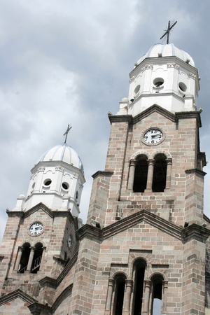 Two bell towers in the Catholic Basilica in the city of Ibarra, Ecuadorの写真素材