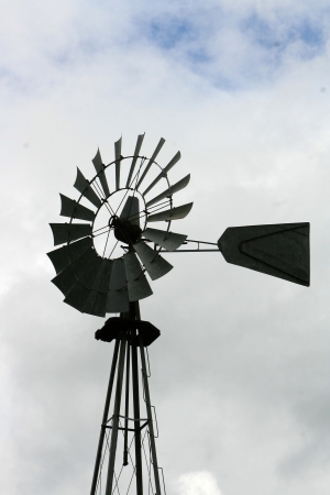 A small windmill on a tower on a farm in Otavalo, Ecuadorの写真素材