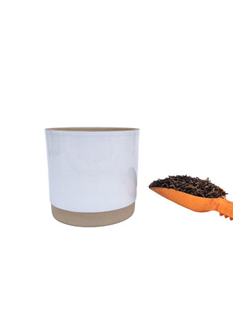 empty clay pot white-brown color with sholve as a gardening tool and little growing medium or media in white backgroundの写真素材