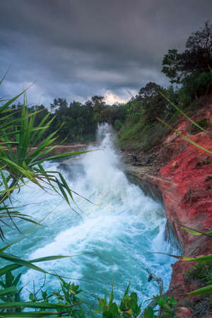 image of cliff with blue water and beach in Indonesia. North Bengkulu view from the top view from the top of the mountain. Travel paradise destination for adventure.の写真素材