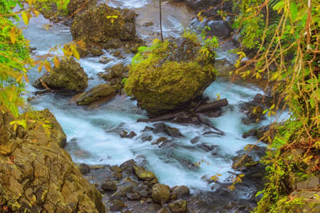 morning view of water flow in cool waterfall and sunrise